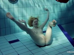 UhPorn presents: Blonde goes for a swim and strips