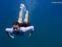 UhPorn presents: Chick gets naked swimming in the ocean
