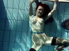 UhPorn presents: In black stockings pretty girl goes for a swim