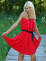 UhPorn presents: Naughty teen appears in her sexy red dress and starts removing it passionately and moving slowly.