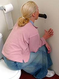 UhPorn presents: Blonde girl Jamie sits on the toilet and blows a black gloryhole dong